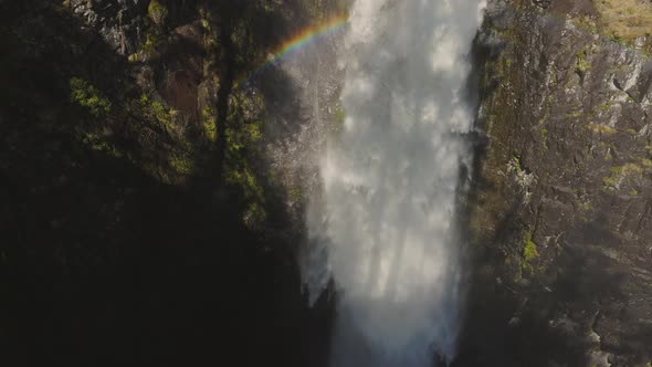 Waterfall Rushing Down a Rocky Canyon in the Canadian Mountains