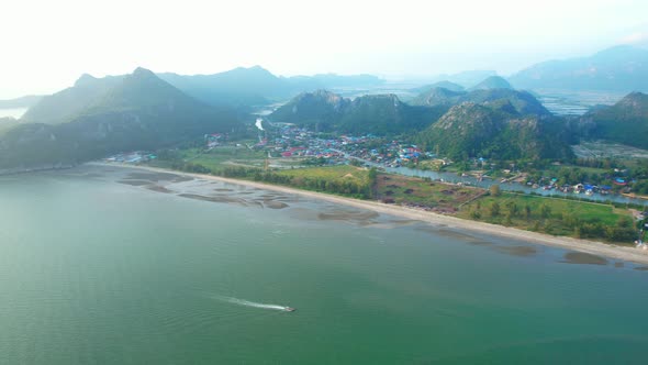 A fishing village amidst the beautiful coastline of Thailand. Mountains on the coast of the sea.