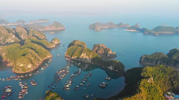 Aerial: sunset clear sky at Cat Ba island and beach with new tourist resort, Halong bay Vietnam