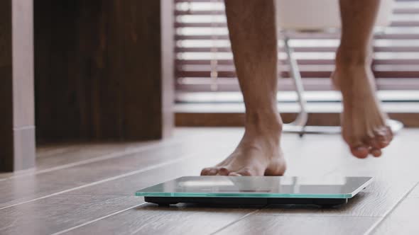 Closeup Male Legs Stand on Electronic Automatic Scales Weight Control Unrecognizable Man Checks Body