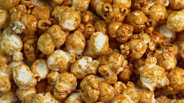 Coffee taste popcorns rotating close up. Caramel popcorn. Healthy food for morning breakfast