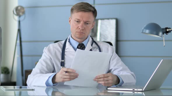 Doctor Reading Documents