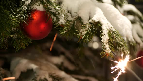 Sparkler Firework Burning Christmas Tree in Snow New Year or Xmas Bengal Light