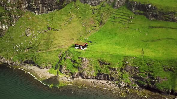 Aerial View of a Lonely House in Saksun Village Faroe Islands