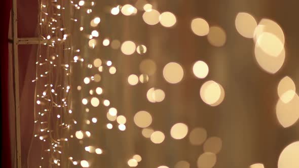 Christmas Garland with Golden Lights Closeup