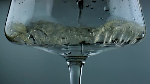 White Wine Filling Glass Closeup