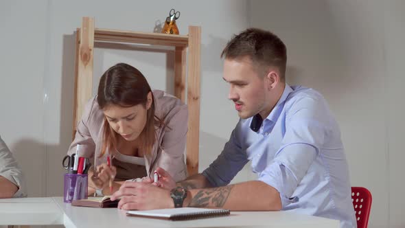 Man and Woman Are Scolding Is Office Room Checking Plan of Works