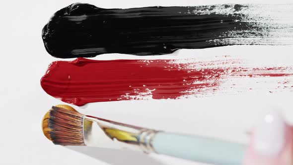 Brush Drawing with Colorful Paint Closeup Black Red and Brown Colours Art Concept