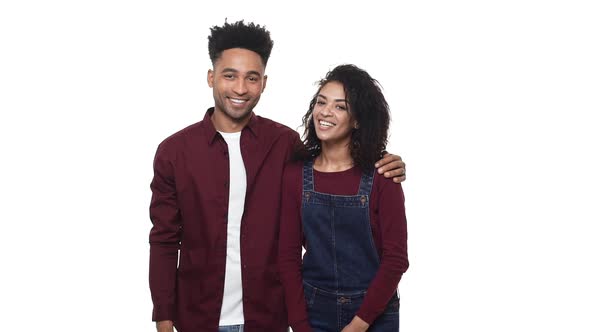 Portrait of African American Couple Huging and Smiling Over White Isolated Background