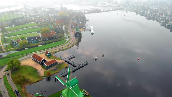 Wooden Wind Mill at the Zaanse Schans Windmill Village During Winter with Sfogy Landscape Wooden