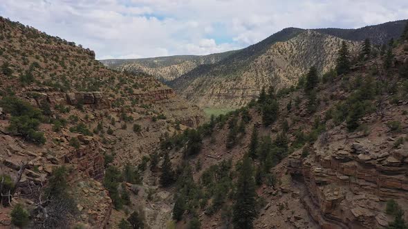 Aerial view flying over canyon in the Utah desert