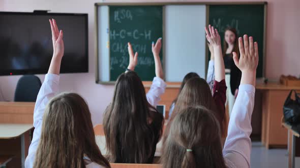 High School Students Stretch Their Hands in the Lesson