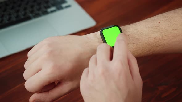 Man Student Using Smartwatch with Chroma Key Closeup