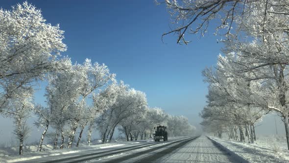 Winter Road With Tractor