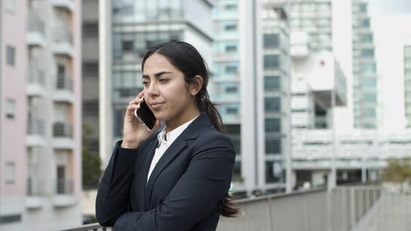 Young Businesswoman Talking By Smartphone