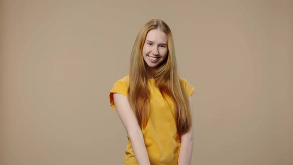 Portrait of Model with Natural Beauty Looking at Camera Making Sign Ok and Smiling