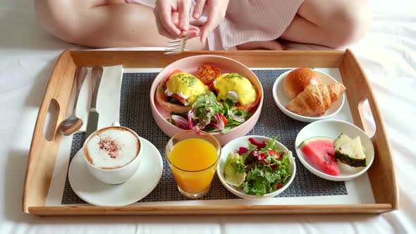 Breakfast in Bed Served with Cup of Coffee Salad Fresh Fruits and Egg Benedict