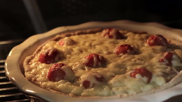 Quiche baking in oven. Timelapse