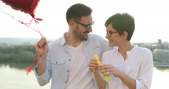 Young Couple in Love Dating and Smiling Outdoor