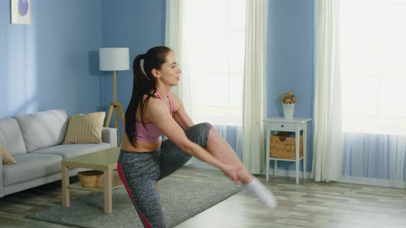 Young Woman Tryies To Stretch Leg