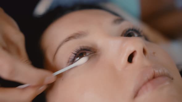 Woman Master in the Beauty Salon Work on Eyelash Extension to the Client