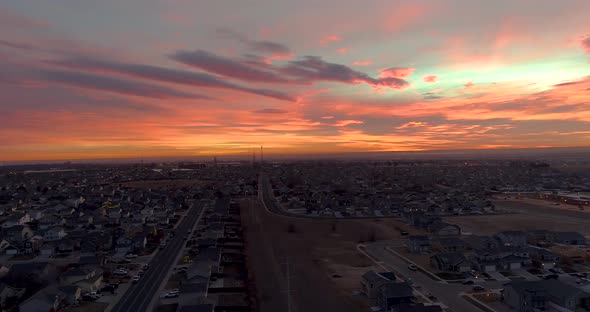 A drone rises over a cityscape to show off an epic Northern Colorado sunrise.