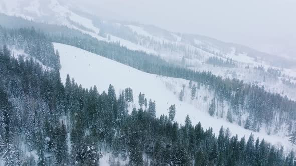 Aerial Footage of Sportsmen Enjoying Active Leisure Within Idyllic Ski Resort