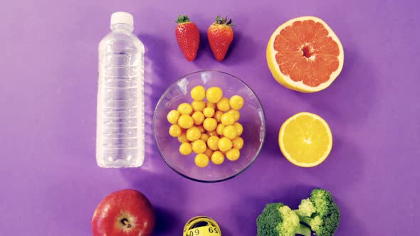 Water bottle, fruits, vegetable and measuring tape