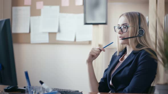 Young Beautiful Woman Working in an Office