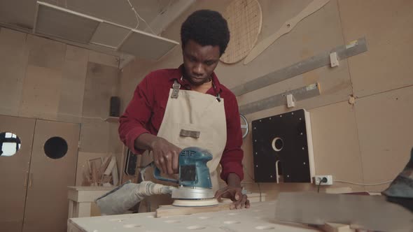 African Male Carpenter Working in Carpentry Workshop
