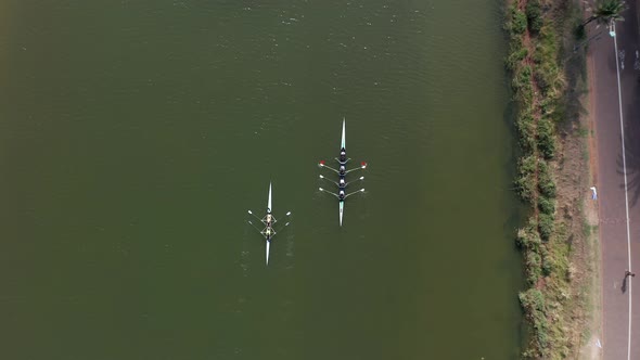 Sport canoe team rowing in a river, Drone footage.