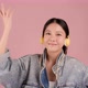 Pretty Asian girl listening music and dancing on pink background. - VideoHive Item for Sale