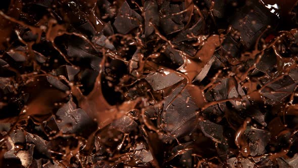 Super Slow Motion Shot of Melted Chocolate Explosion Through Chocolate Chunks at 1000 Fps