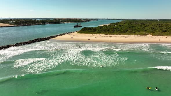 Aerial Clip People Surfing At Fort Pierce Inlet