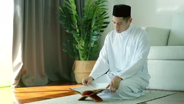 Asian Muslim Man Reading the Qur'an 04