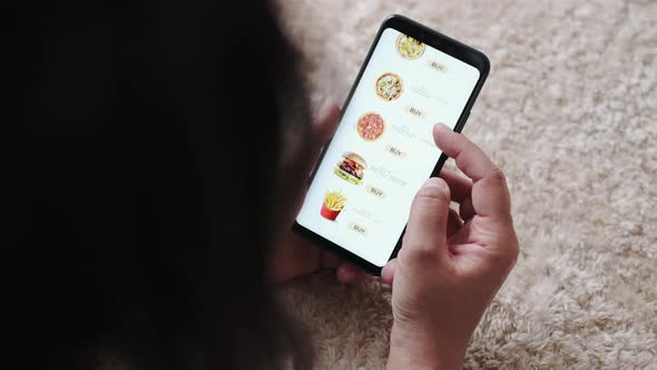 Female Orders Pizza and Fast Food Meal Using Online Delivery Service