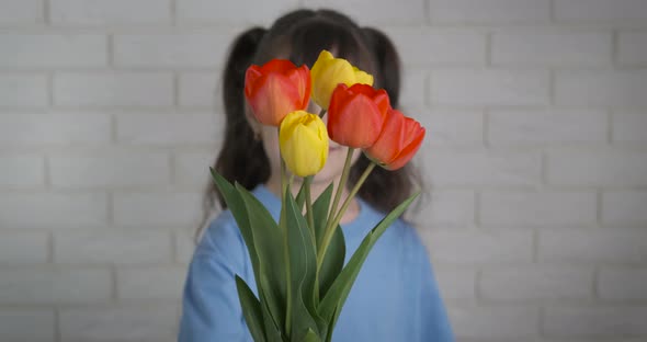 Girl receives flowers.