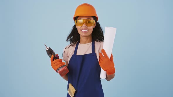 Afroamerican Girl Worker in Hard Hat Protective Goggles Gloves