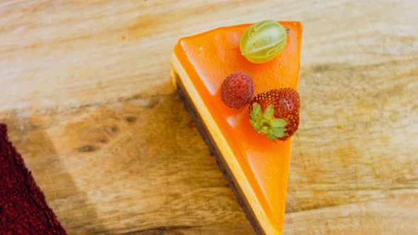 A Slice of Cake with Orange Peach and Strawberry Jelly