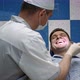 Male Dentist Examining Teeth of His Male Client - VideoHive Item for Sale