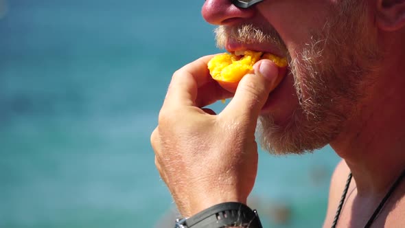 Man Eating Peach