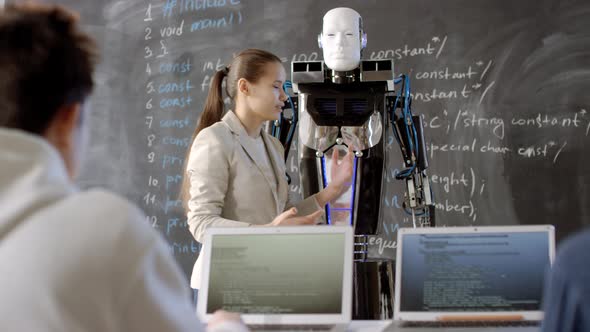 Female Student Making Report On Robotics