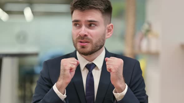 Frightened Young Businessman Feeling Scared 