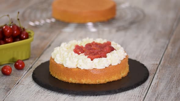 Woman Making The Naked Cherry Cake With Vanilla Cream.