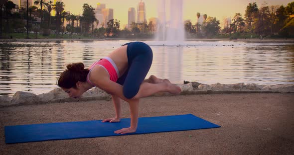 Woman Doing Yoga In The Park At Dawn