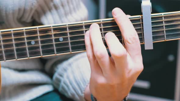 Guy Musician Plays an Acoustic Guitar