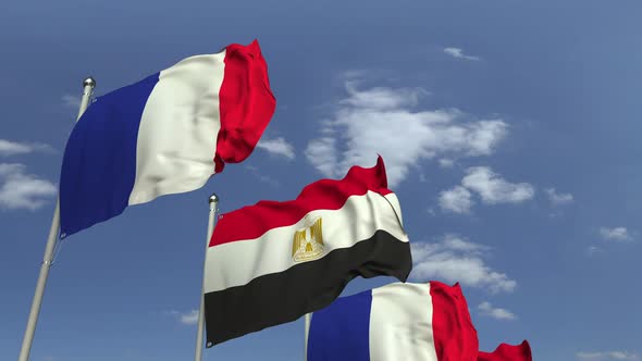 Flags of Egypt and France Against Blue Sky