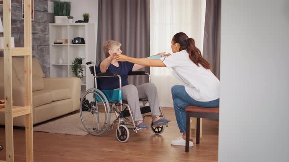 Rehabilitation for Old Woman in Wheelchair