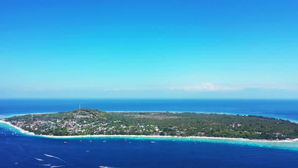 Natural above copy space shot of a white paradise beach and blue ocean background in vibrant 4K