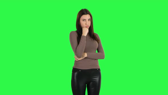 Attractive Girl Stands Offended and Then Smiles. Green Screen